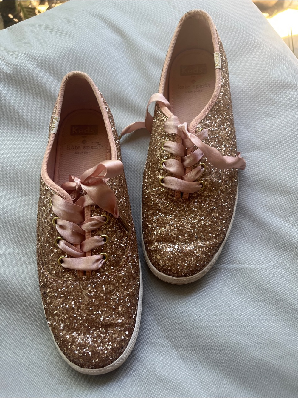 kate spade glitter sneakers in blush pink and rose gold